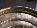 a close up of a metal bowl on a table