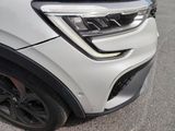 a close up of the front end of a white suv