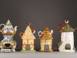 five different types of teapots on display in a row