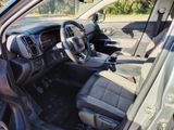 the interior of a car with a steering wheel and dashboard