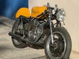 a motorcycle that is parked on the side of the street