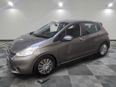 a picture of a silver car parked in a garage