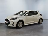 a white toyota yaris parked in a white room