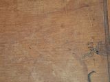 an old wooden box with a handle on top of it