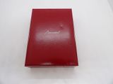 a red book sitting on top of a white table