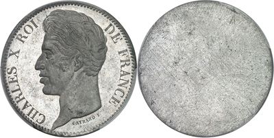 a close up of a coin on a white background