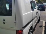 a white van that is parked in a parking lot