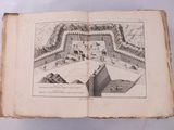 un livre ouvert sur lequel est dessiné un château