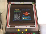 a close up of a video game machine in a glass case