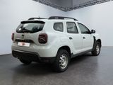 a picture of a white pick up truck parked in a garage