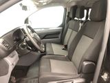 a view of a car ' s interior from the driver ' s seat