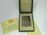 an image of a box with a silver plated cigarette in it