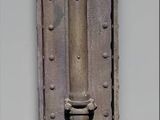 a picture of a metal object with a face on it