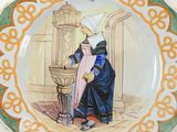 a plate with a picture of a woman in a blue dress