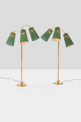 a pair of green lamps on a white surface