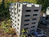 concrete blocks stacked on top of each other in a field