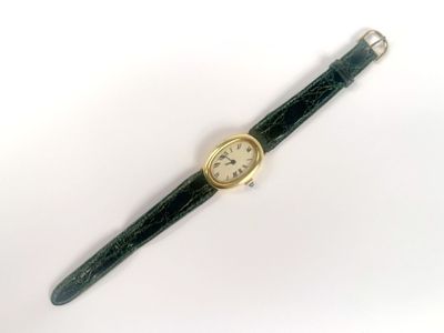 an image of a watch on a white surface with a white background