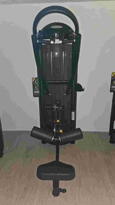 a black and green machine sitting on a black chair