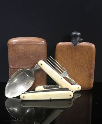 a knife, spoon, and other items on a table