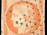 an orange and black stamp with a woman ' s head on it