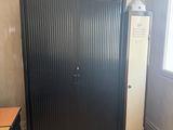 an image of a kitchen with a refrigerator and a washing machine