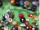 many different types of buttons and buttons in a box