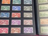 a lot of stamps in a book on a table