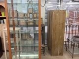 a glass display case in the middle of a room