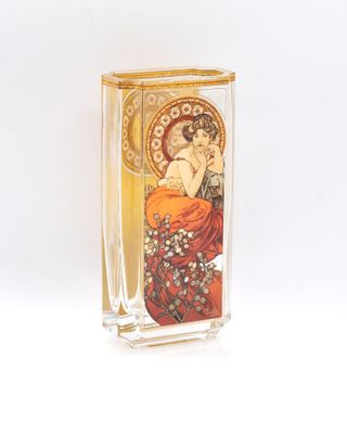 a glass vase with a picture of a woman on it
