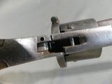 a pair of pliers that are attached to a piece of metal