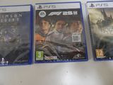 three ps5 games are sitting on a table next to each other