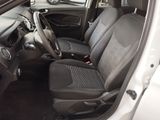 the interior of a small car with black seats and a steering wheel