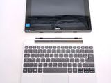 a laptop and a tablet on a white table