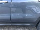 a close up of a car door handle and the door handle of the car