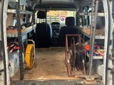 an image of a van that is parked in a garage