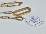 two gold - plated paper clips with a tag attached to them