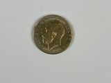 l'image d'une pièce de monnaie sur une surface blanche