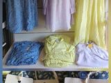 a display of clothing on a shelf in a store