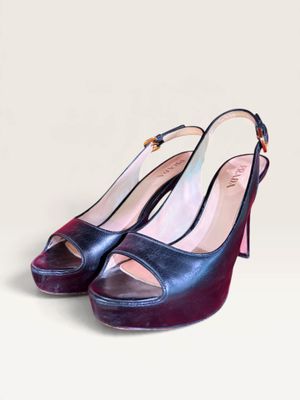 a close up of a pair of shoes on a white surface