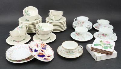 a lot of plates and cups and saucers on the table