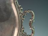 a silver plate that is sitting on a table