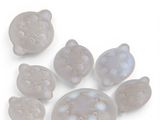 a picture of a group of glass cats on a white surface