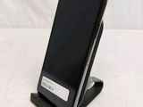 a cell phone that is sitting on top of a stand