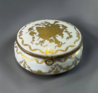 an image of a white and gold box sitting on top of a table