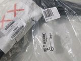 a plastic bag with a red cross on it sitting on a table