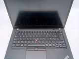 a laptop with a keyboard on it sitting on a table