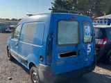 an image of a blue van parked in a parking lot