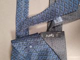 two ties that are tied together on a table