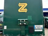 a green box truck with a yellow z logo on it