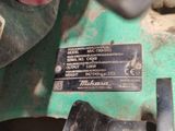 a close up of a metal object on a green surface